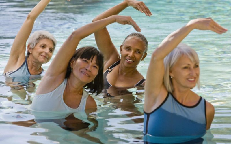 Multi-ethnic senior women exercising in swimming pool